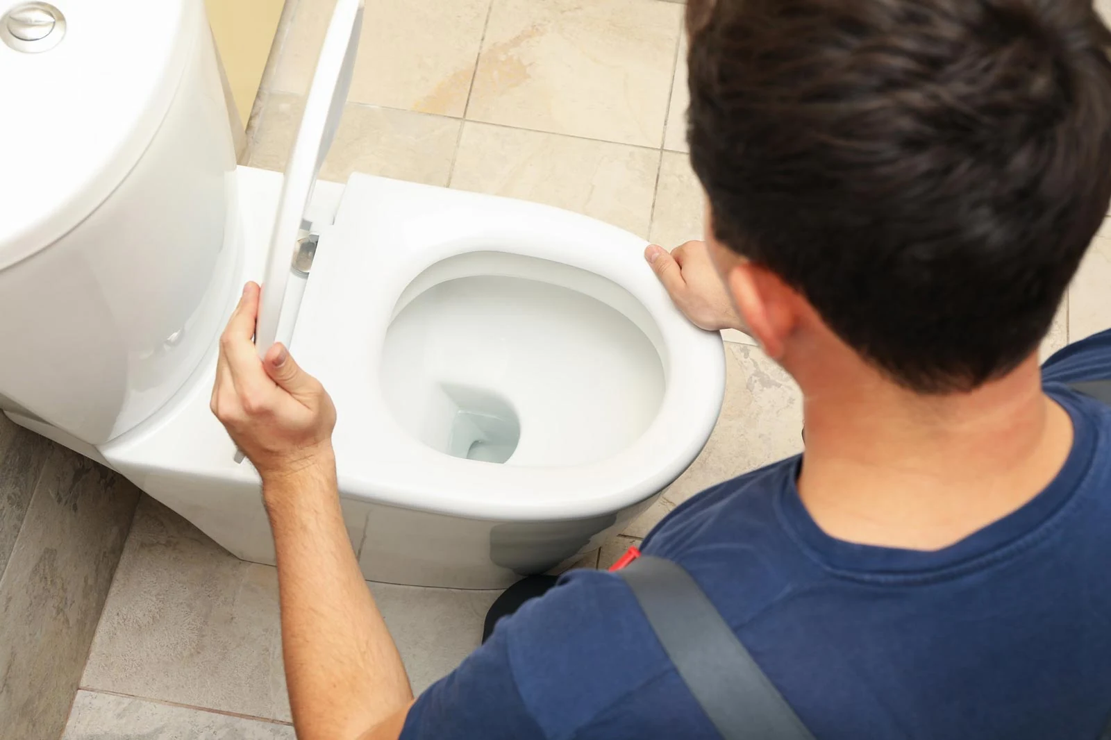 plumber fixing toilet in gta
